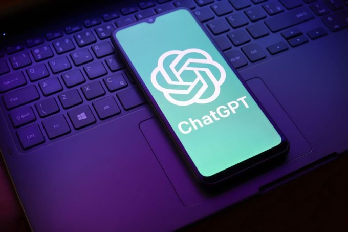 The ChatGPT logo appears on a smartphone screen